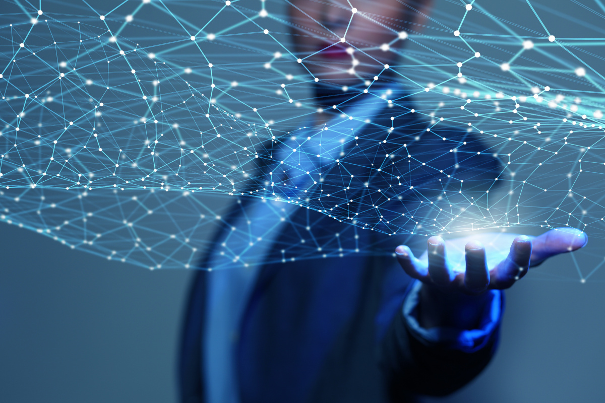 Business woman holding a digital network diagram