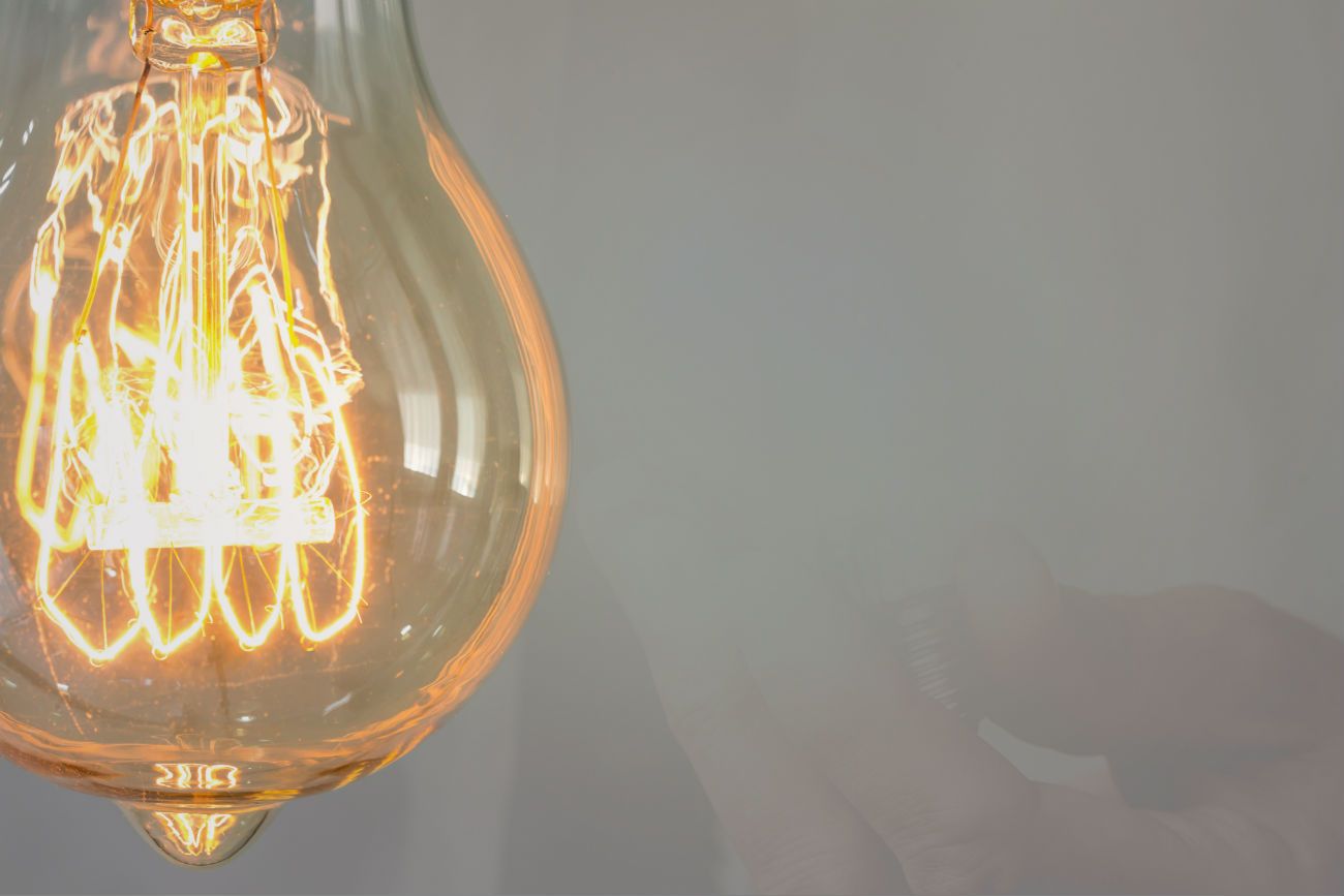 Close up of an old-style wire filament light bulb