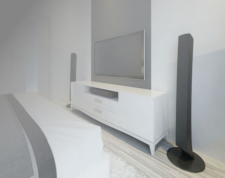 TV screen mounted in bedroom above a white cabinet