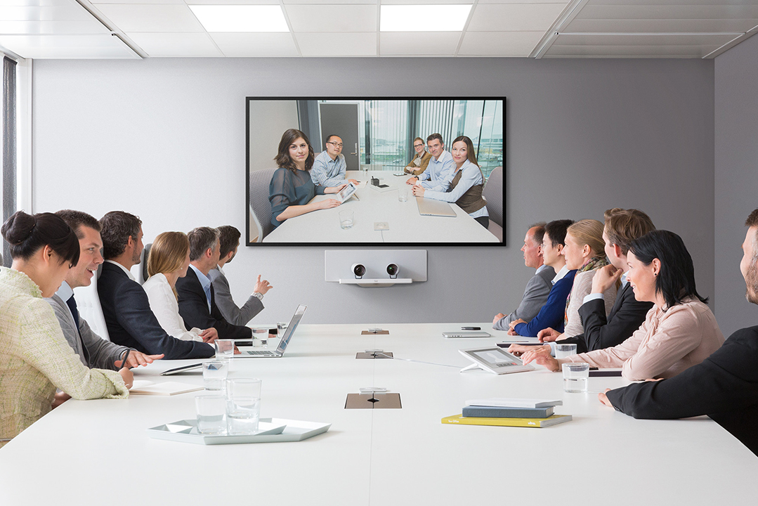 Staff meeting in teleconferencing room